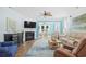 Open living area with hardwood floors, fireplace, ceiling fan, and comfortable seating at 1290 Prescott Circle, Myrtle Beach, SC 29577
