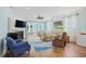 Bright living room with hardwood floors, fireplace, ceiling fan, and comfortable seating at 1290 Prescott Circle, Myrtle Beach, SC 29577