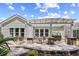 A spacious patio with a pergola, bar, and comfortable seating, ideal for outdoor entertaining and relaxation at 1290 Prescott Circle, Myrtle Beach, SC 29577
