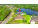 Aerial view showing a house near a lake with pool, close to a road and other residences at 131 Sago Palm Dr., Myrtle Beach, SC 29579