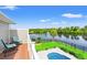 Relaxing balcony offers seating and picturesque views of the tranquil lake and pool at 131 Sago Palm Dr., Myrtle Beach, SC 29579