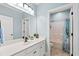 Stylish bathroom featuring a modern vanity and tiled shower at 131 Sago Palm Dr., Myrtle Beach, SC 29579
