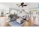 Well-lit living room featuring stairs, bar seating, and an open floor plan at 131 Sago Palm Dr., Myrtle Beach, SC 29579