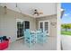 Inviting covered patio with cozy seating and a ceiling fan, ideal for outdoor dining at 131 Sago Palm Dr., Myrtle Beach, SC 29579