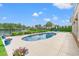 Stunning backyard oasis with a pool, a serene lake view, and meticulously manicured landscaping at 131 Sago Palm Dr., Myrtle Beach, SC 29579