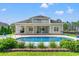 This home features a beautiful backyard with a pool and an amazing view of the lake at 131 Sago Palm Dr., Myrtle Beach, SC 29579