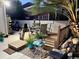 Cozy backyard deck with an outdoor seating area and a stone waterfall at 1504 Saint Thomas Circle, Myrtle Beach, SC 29577