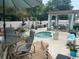 Cozy backyard with a hot tub, pergola, lounge chairs, and outdoor dining area at 1504 Saint Thomas Circle, Myrtle Beach, SC 29577
