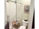 Clean bathroom showcases a new glass shower stall, decor, and wooden stool at 1504 Saint Thomas Circle, Myrtle Beach, SC 29577