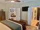 Relaxing bedroom featuring a TV, ensuite bathroom and connected seating area at 1504 Saint Thomas Circle, Myrtle Beach, SC 29577