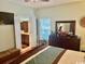 Comfortable bedroom featuring a dresser, TV, and doorway to the Primary bath at 1504 Saint Thomas Circle, Myrtle Beach, SC 29577