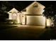An exterior nighttime view of a lovely home with an attached two-car garage at 1504 Saint Thomas Circle, Myrtle Beach, SC 29577