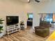 Comfortable living room with a large TV, recliner, and sliding glass doors to the outdoor space at 1504 Saint Thomas Circle, Myrtle Beach, SC 29577