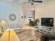 Open-concept living room with a cozy sofa, entertainment center, and stylish decor throughout at 1504 Saint Thomas Circle, Myrtle Beach, SC 29577
