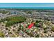 Aerial view showcases a community with many homes, trees, and ponds, near the ocean at 1527 Hallborough Dr., Surfside Beach, SC 29575
