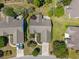 Aerial view of home showcasing its location, roof, landscaping, and driveway at 1527 Hallborough Dr., Surfside Beach, SC 29575