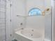 Relaxing bathroom features a jetted tub with tile surround and decorative fixtures at 1527 Hallborough Dr., Surfside Beach, SC 29575