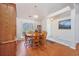 Bright dining room featuring wood floors, a chandelier, and a large window for ample natural light at 1527 Hallborough Dr., Surfside Beach, SC 29575