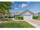 Charming single-story home with a well-manicured lawn, lush landscaping, and a two-car garage at 1527 Hallborough Dr., Surfside Beach, SC 29575