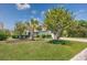 Charming front yard with lush lawn, manicured landscaping, and a welcoming driveway at 1527 Hallborough Dr., Surfside Beach, SC 29575