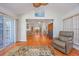 Bright and airy living room with a vaulted ceiling, ceiling fan, and hardwood flooring, with views to other rooms at 1527 Hallborough Dr., Surfside Beach, SC 29575