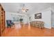 Bright living room featuring hardwood floors, neutral paint, and a ceiling fan for comfortable living at 1527 Hallborough Dr., Surfside Beach, SC 29575