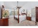 Spacious main bedroom features a vaulted ceiling, ceiling fan, and large windows for natural light at 1527 Hallborough Dr., Surfside Beach, SC 29575