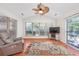 Sunlit sunroom with a vaulted ceiling, a ceiling fan, and large windows offering views of the backyard at 1527 Hallborough Dr., Surfside Beach, SC 29575