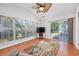 Bright sunroom with large windows, a ceiling fan, and sliding door for indoor-outdoor living at 1527 Hallborough Dr., Surfside Beach, SC 29575