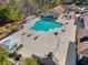 Aerial view of a community pool and clubhouse featuring a large pool deck and multiple seating areas at 1631 Murrell Pl., Murrells Inlet, SC 29576