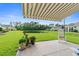 Patio overlooking a well-manicured lawn, lake, and view of the neighborhood at 1631 Murrell Pl., Murrells Inlet, SC 29576