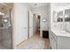 This bathroom features beige tile, a glass shower and extra storage at 1631 Murrell Pl., Murrells Inlet, SC 29576