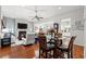 Bright dining area with a modern table and chairs adjacent to the living room and kitchen at 1631 Murrell Pl., Murrells Inlet, SC 29576