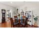 Cozy dining area with a glass-top table, hardwood floors, and stylish decor at 1631 Murrell Pl., Murrells Inlet, SC 29576