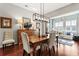 Dining area with views of the outdoor space and an open living area for entertaining at 1631 Murrell Pl., Murrells Inlet, SC 29576