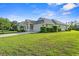 Inviting single-story home featuring a well-manicured lawn, an attached garage and an American flag at 1631 Murrell Pl., Murrells Inlet, SC 29576