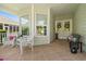 Inviting covered front porch with wicker furniture and a view of the home's entrance at 1631 Murrell Pl., Murrells Inlet, SC 29576