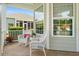 Cozy front porch featuring comfortable wicker seating, great for relaxing and enjoying the outdoors at 1631 Murrell Pl., Murrells Inlet, SC 29576
