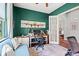 Spacious home office with a white desk, ample natural light, and access to other rooms at 1631 Murrell Pl., Murrells Inlet, SC 29576
