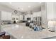 Bright kitchen with large island, granite counters, stainless appliances, and white cabinets at 1631 Murrell Pl., Murrells Inlet, SC 29576