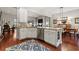 Open concept kitchen with stainless steel appliances and granite countertops overlooks the dining and living area at 1631 Murrell Pl., Murrells Inlet, SC 29576