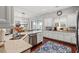 Well-lit kitchen with granite countertops, stainless steel appliances, and an open view to the dining area at 1631 Murrell Pl., Murrells Inlet, SC 29576