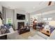 Spacious living room with a fireplace, hardwood floors, and an open layout to the dining area at 1631 Murrell Pl., Murrells Inlet, SC 29576