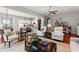 Open-concept living room with hardwood floors seamlessly flowing into the kitchen and dining areas at 1631 Murrell Pl., Murrells Inlet, SC 29576