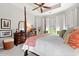 This main bedroom boasts a four-poster bed, tray ceilings, and wooden dressers at 1631 Murrell Pl., Murrells Inlet, SC 29576
