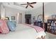 This main bedroom boasts a four-poster bed, tray ceilings, and a TV at 1631 Murrell Pl., Murrells Inlet, SC 29576