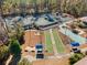 Aerial view of community amenities including tennis courts, bocce ball and shuffleboard at 1631 Murrell Pl., Murrells Inlet, SC 29576