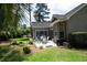 Backyard featuring lush greenery, patio seating, and mature landscaping at 170 Glenwood Dr., Conway, SC 29526