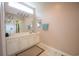 Bathroom features a vanity with double sinks, a large mirror, and tiled floors at 170 Glenwood Dr., Conway, SC 29526