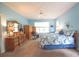 Spacious bedroom features an en suite, large window, ceiling fan, and lots of natural light at 170 Glenwood Dr., Conway, SC 29526